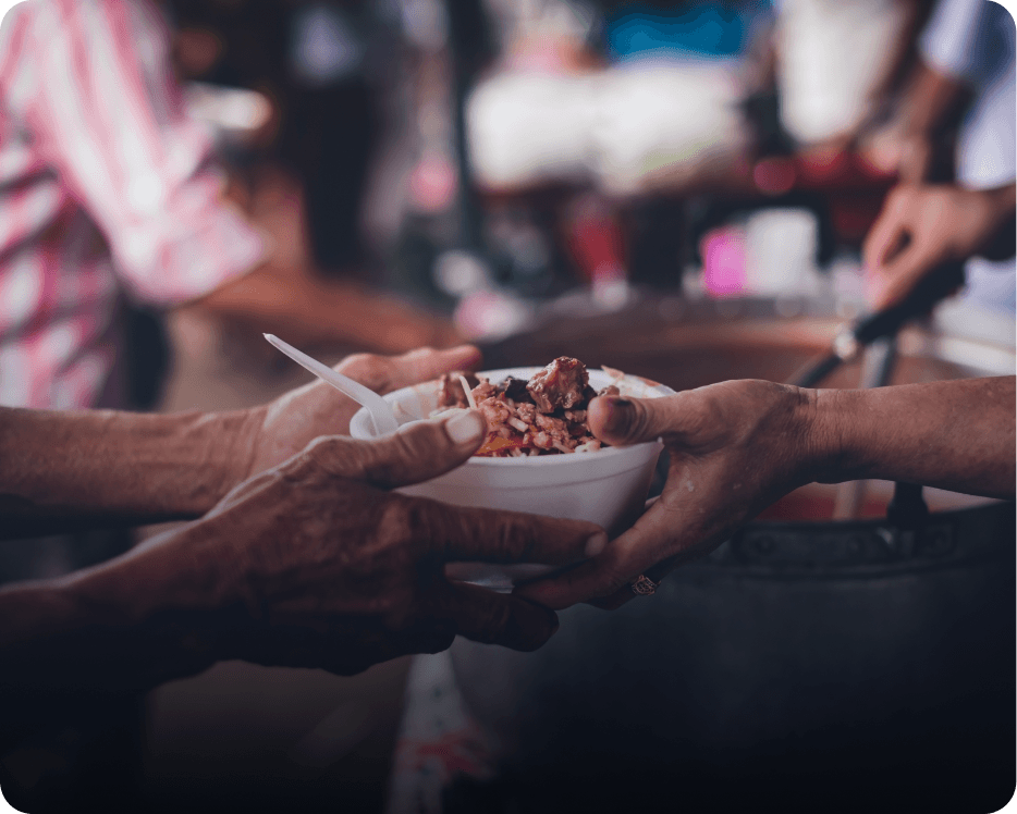 Compassionate hands offering a meal