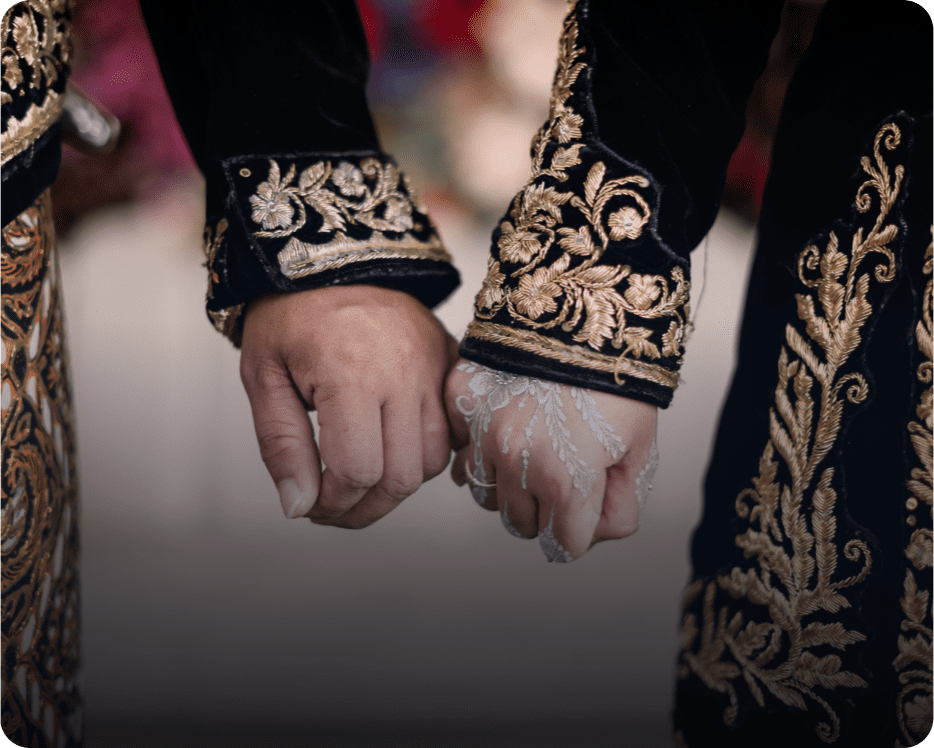 Elegant embroidered sleeves holding hands