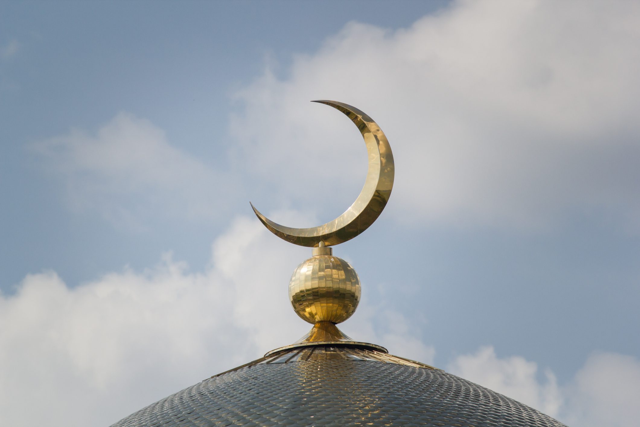 Mosque dome with golden crescent symbol