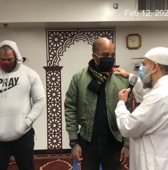 Group of men conversing in a mosque