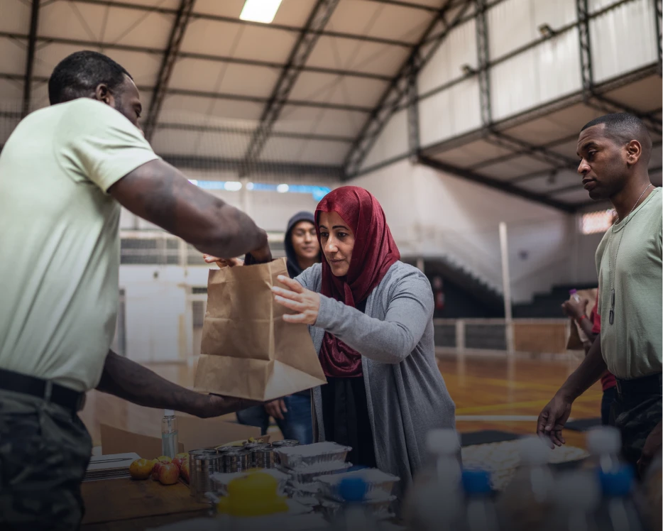Group receiving food donations at an event.