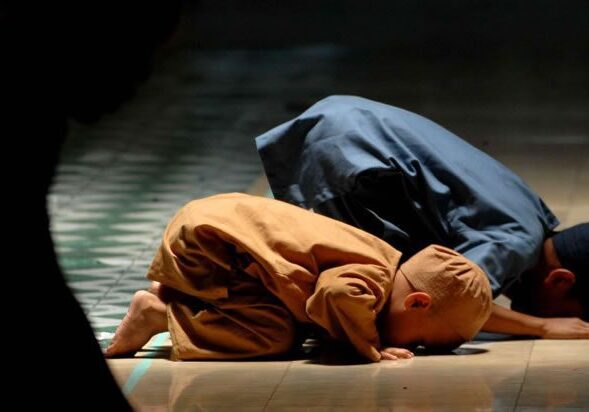 Child and adult praying together